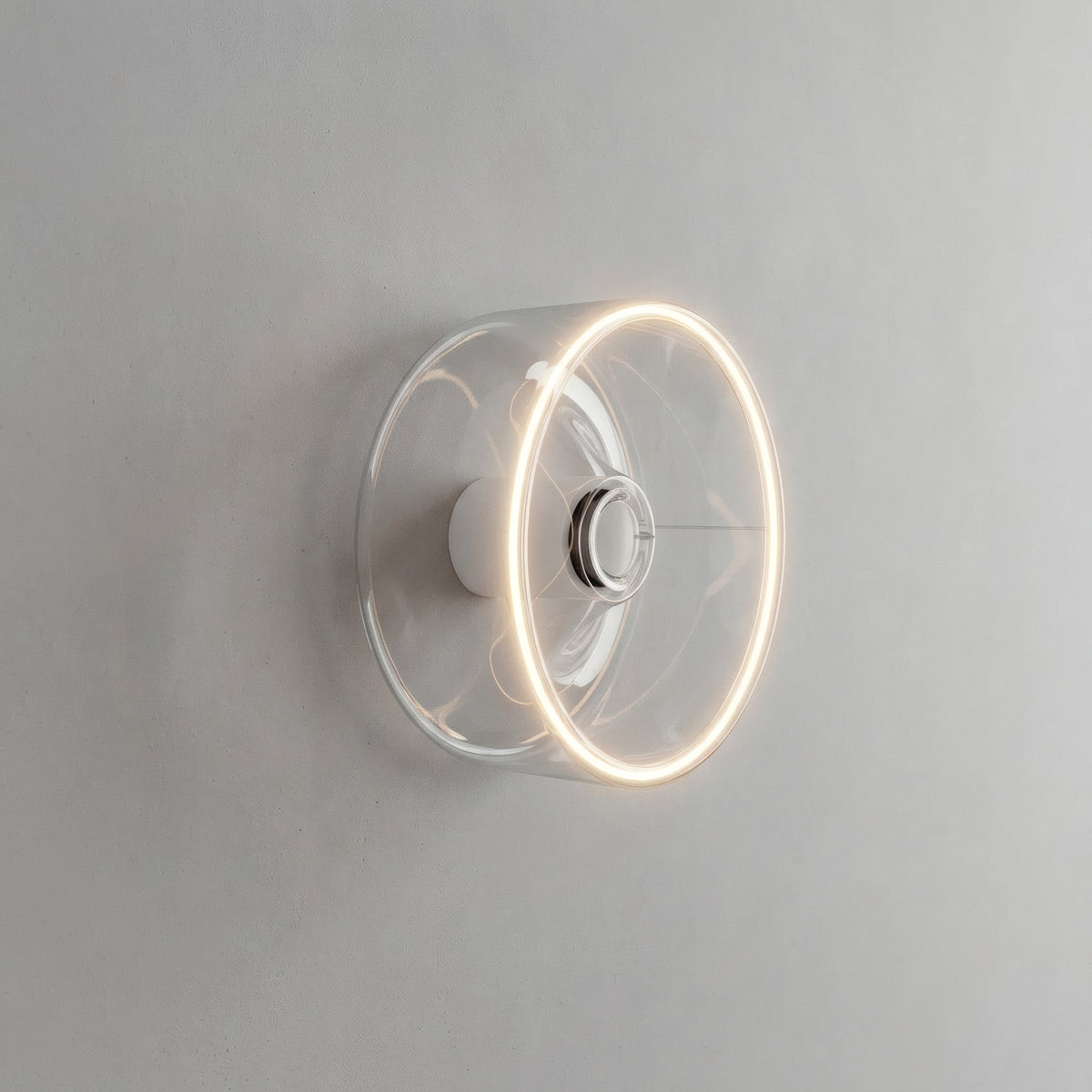 E27 LED donut bulb in clear glass, Ø 195 mm, lit as a wall light in a pared-back interior