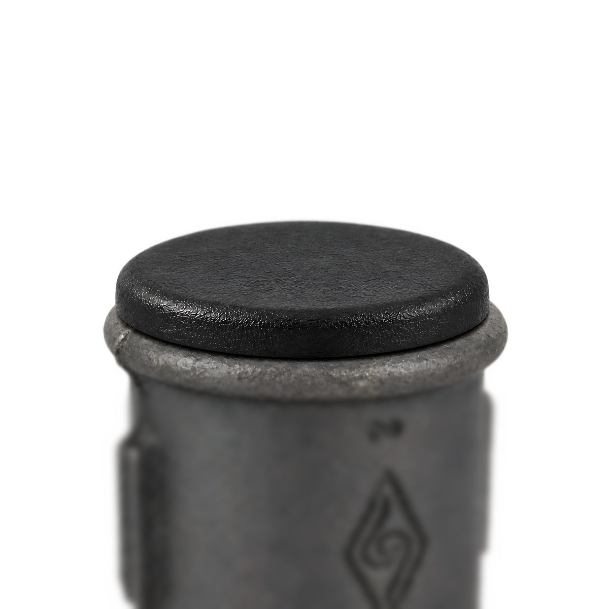 Black plastic insert closing an Eco black malleable iron coupling