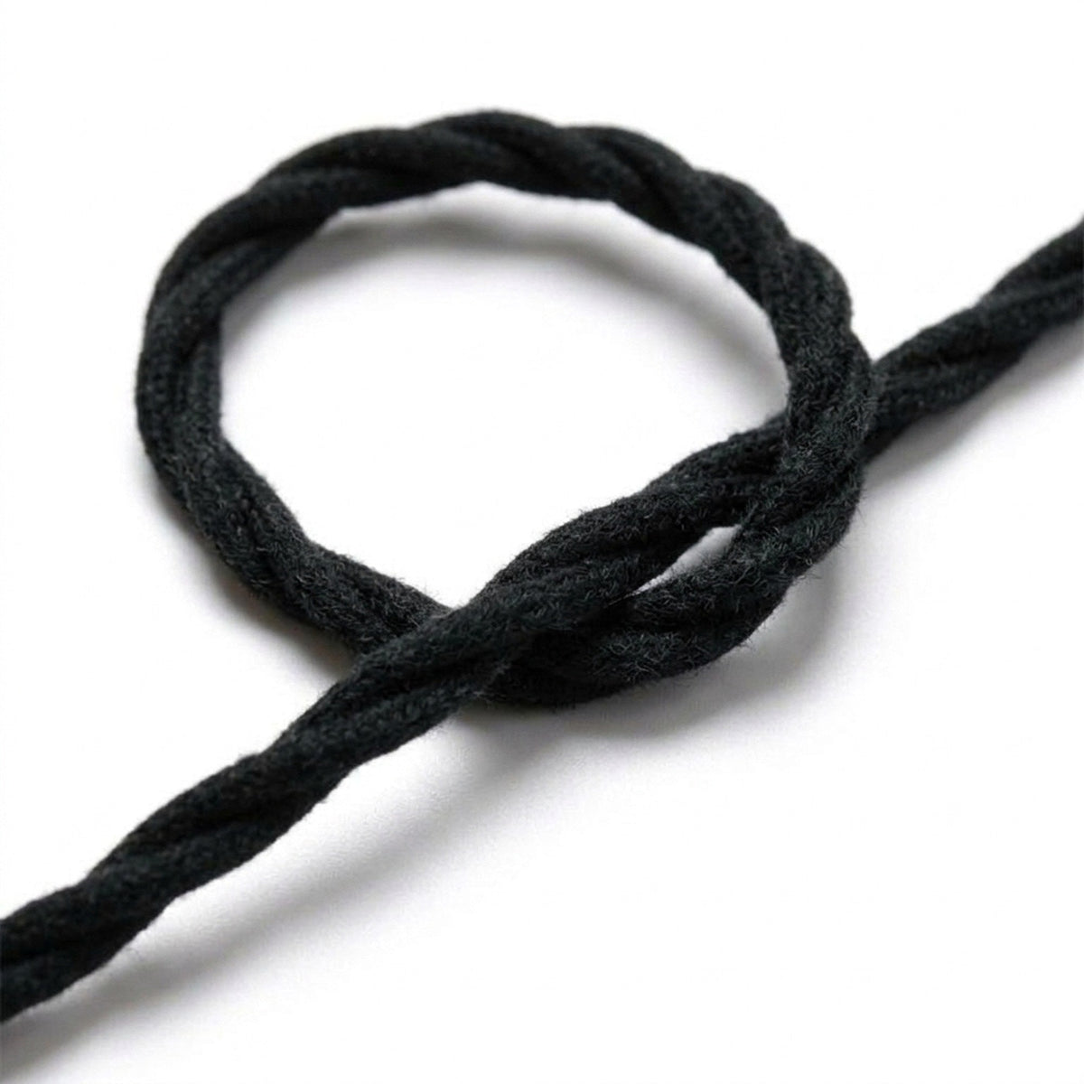 Close-up of the twisted fabric cable, charcoal black cotton