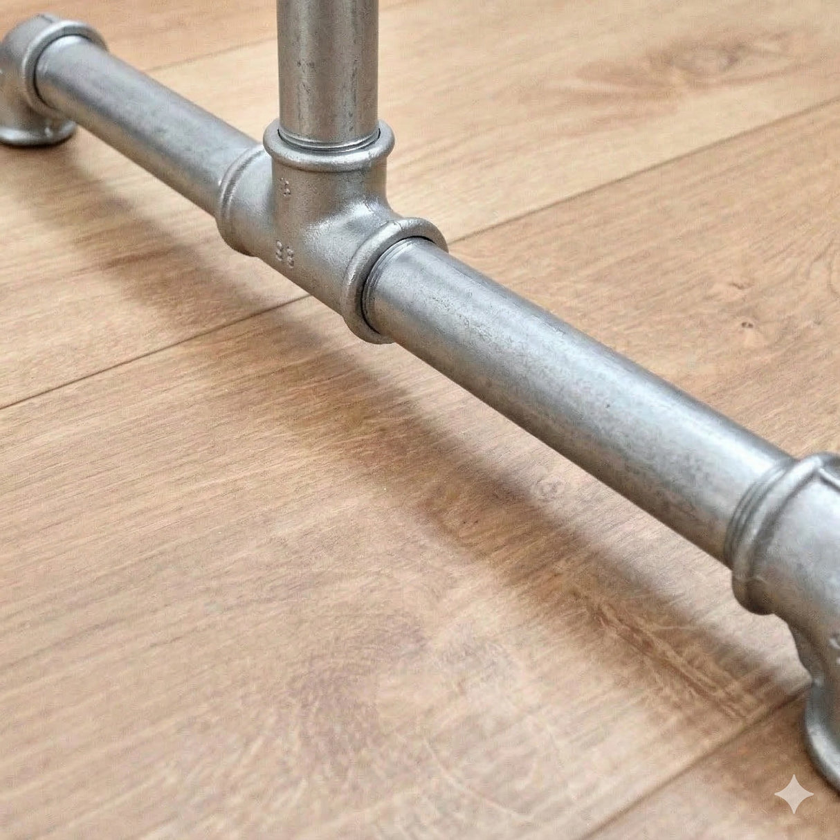 Detail of the galvanized stand foot with cast iron fittings and threaded tubes