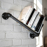 Cast iron wall bookshelf on a brick wall with books, loft setting