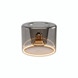 E27 LED donut bulb in smoked glass, Ø 120 mm, switched on, warm light ring, white background