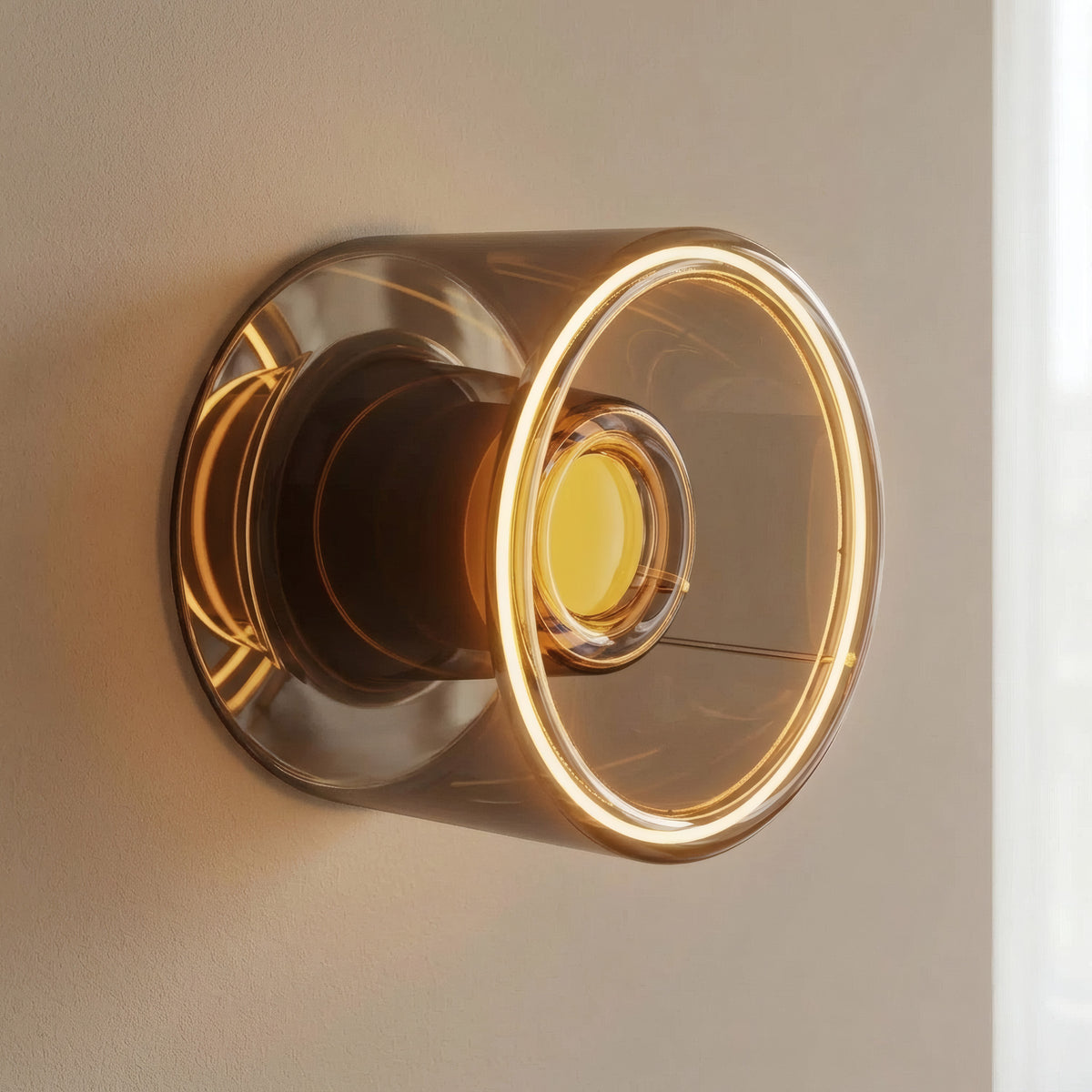 E27 LED donut bulb in smoked glass, Ø 120 mm, lit as a wall light on a plain neutral wall