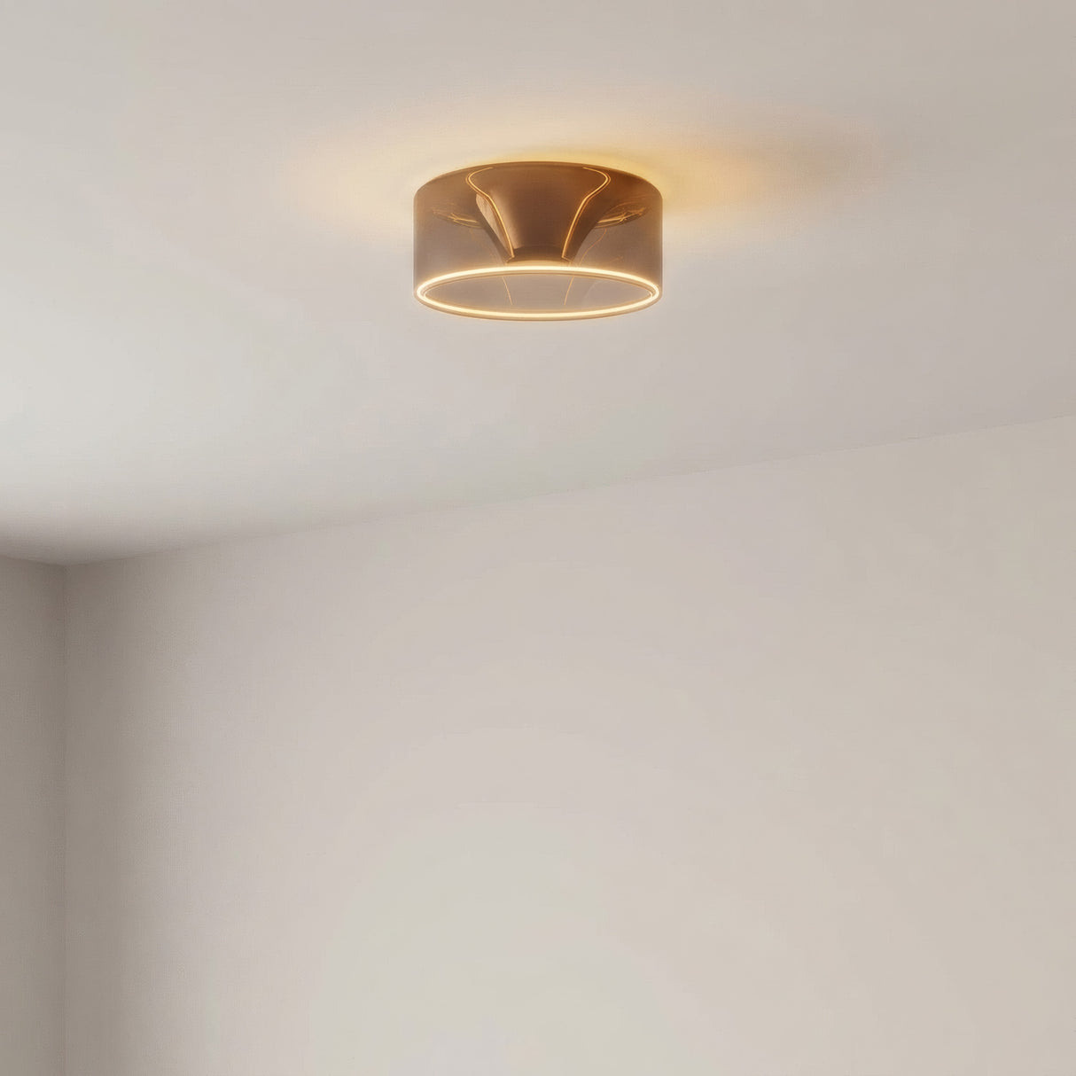 E27 LED donut bulb in smoked glass, Ø 195 mm, lit on the ceiling of a room with pale walls