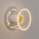 E27 LED donut bulb in clear glass, Ø 120 mm, lit as a wall light in a minimalist setting