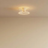 E27 LED donut bulb in clear glass, Ø 195 mm, lit on the ceiling of a pared-back interior