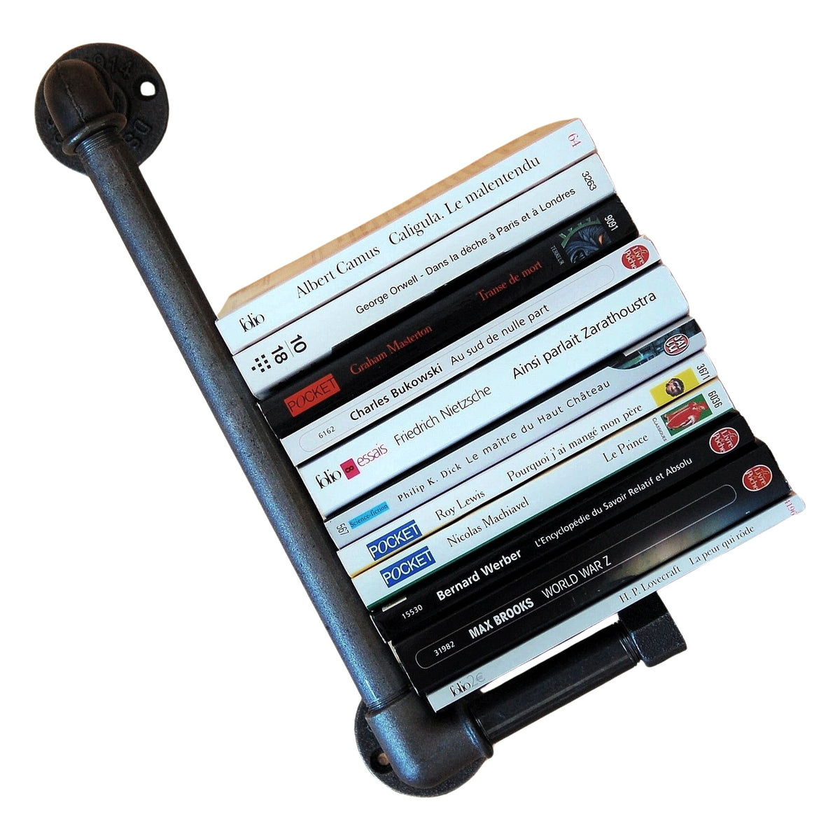 Cast iron paperback shelf mounted at an angle, books held by the retaining bar