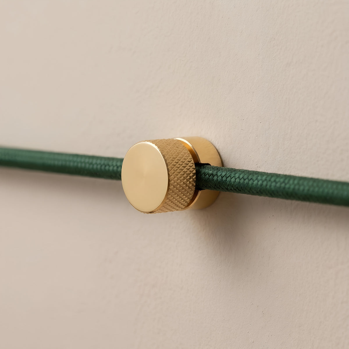 Metal wall-mount cable clip for fabric cable — Brass