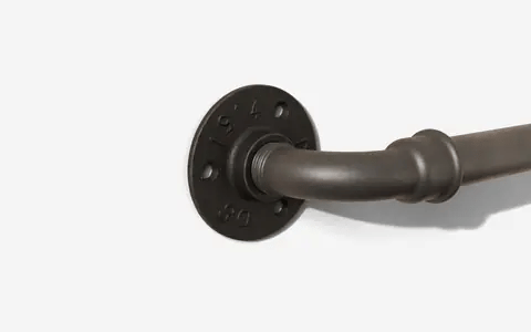 Black screw being driven through the flange