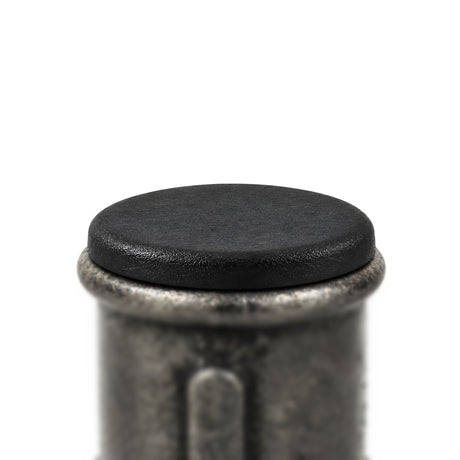 Black plastic insert fitted in a Premium black malleable iron coupling, flat head resting on the edge