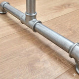 Detail of the galvanized stand foot with cast iron fittings and threaded tubes