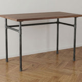 Industrial desk with walnut top on U-frame cast iron and steel base Ø 27 mm, lifestyle scene (top not included)