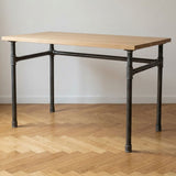 Industrial desk with light oak top on U-frame cast iron and steel base Ø 34 mm, lifestyle scene (top not included)