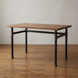 Industrial desk with walnut top on U-frame cast iron and steel base Ø 42 mm, lifestyle scene (top not included)