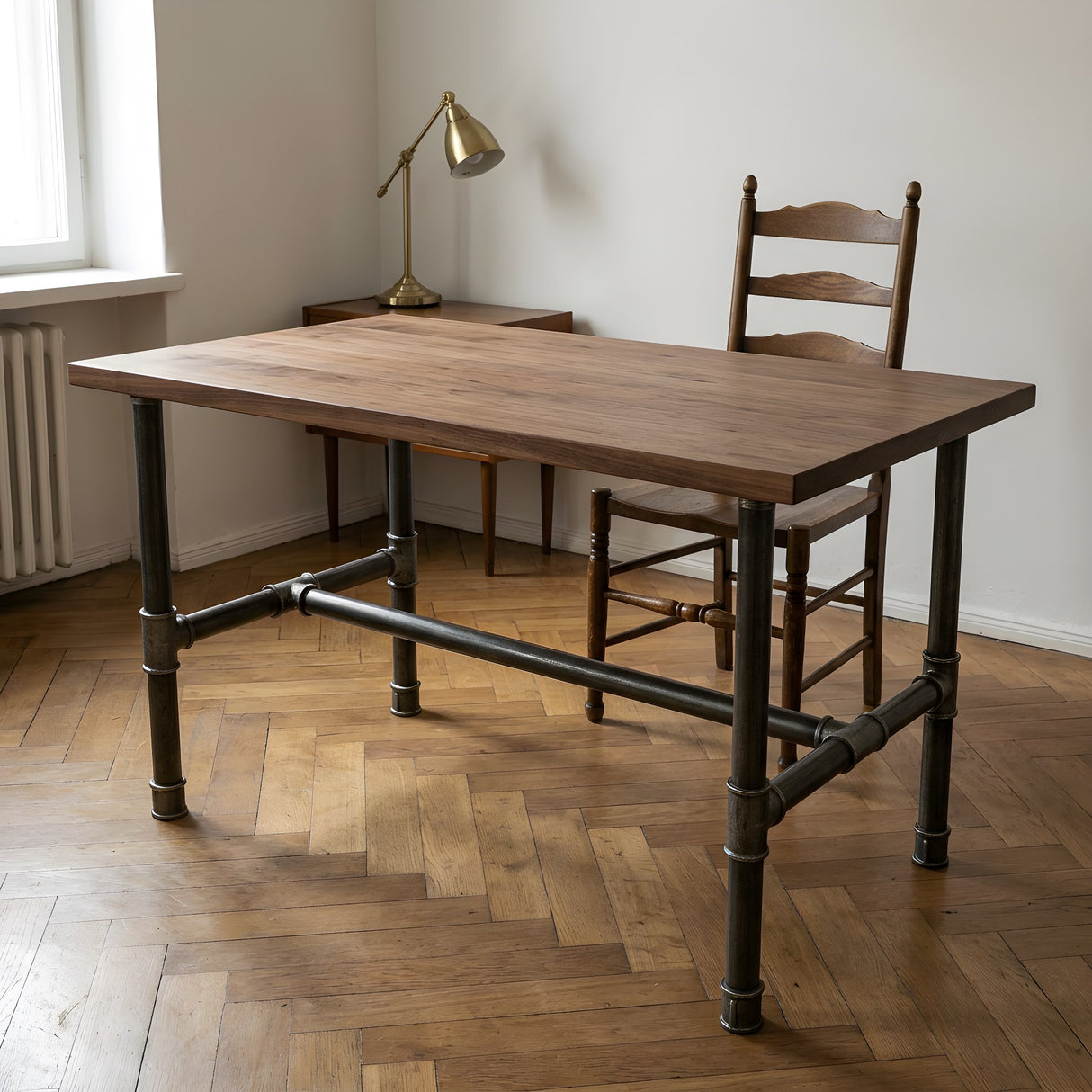 H-frame dining table base, cast iron and varnished steel Ø 34 mm, shown in a room under a solid walnut tabletop