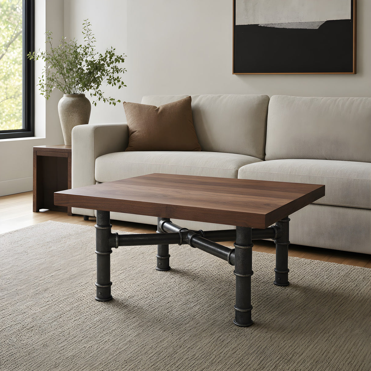 Cross-leg coffee table base, cast iron and varnished steel Ø 42 mm, shown in a room under a solid walnut tabletop