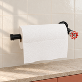 Black kitchen roll holder with red handwheel — wall-mounted with a kitchen roll