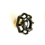 Door handle button with black valve wheel made of brass